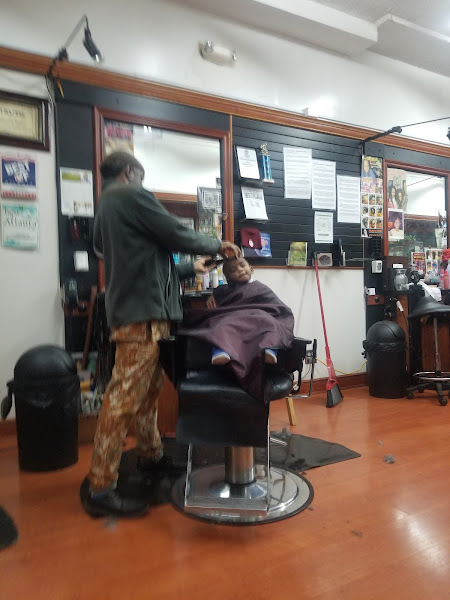 ROYAL CROWN BARBERSHOP & NATURAL HAIR SALOON 4